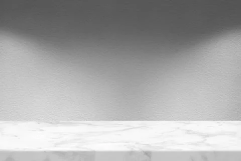 Marble Table with White Stucco Wall Texture Background with Spotlight from .. Stock Photos