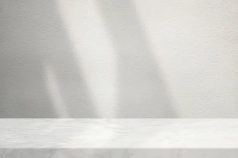 Marble Table with White Stucco Wall Texture Background with Light Beam and .. Stock Photos
