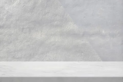 Marble Table with White Stucco Wall Texture Background with Light Beam and .. Stock Photos