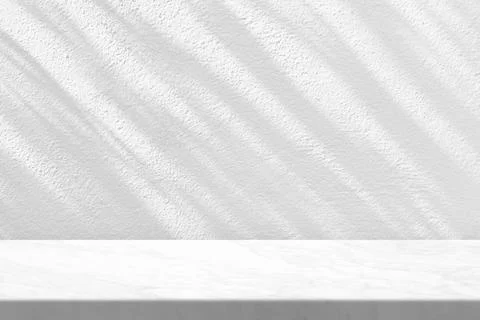Marble Table with White Stucco Wall Texture Background Stock Photos
