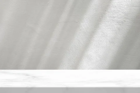 Marble Table with White Stucco Wall Texture Background. Stock Photos