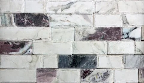 Marble texture decorative brick, wall tiles made of natural stone. Building Stock Photos
