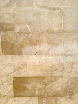 Marble tiles with a beautiful pattern in brown tones Stock Photos