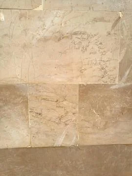 Marble tiles with a beautiful pattern in brown tones Stock Photos