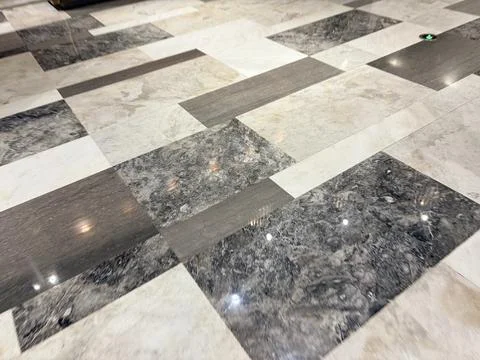 Marble tiles in a herringbone pattern. Stock Photos