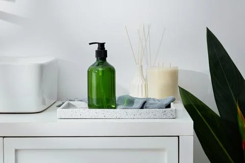 Marble tray in rectangle shape containing a transparent pump bottle and a tow Stock Photos