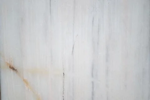Marble wall with natural patterns and textures in sunlight Fotos Stock