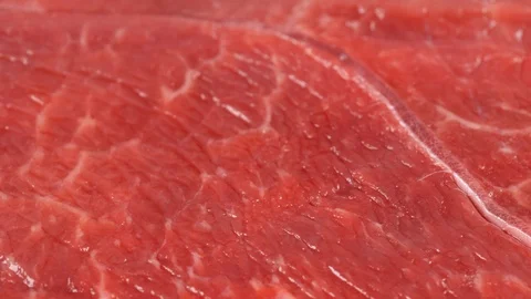 Marbled beef rotating, low angle. Meat close up macro. Surface of fresh steak Stock Footage 121170675
