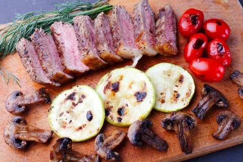 Marbled beef steak sliced on a cutting board Foto stock
