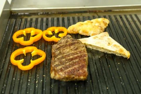 Marbled beef steaks grilled with pepper and bread Stock Photos