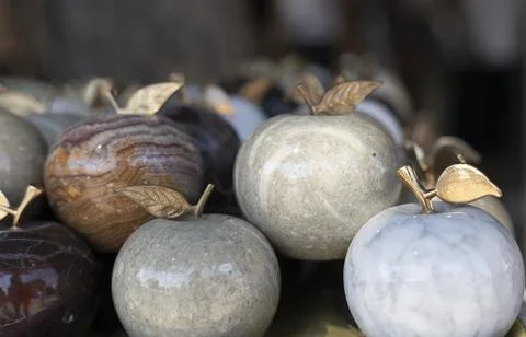 Marbled patterned apples. Too many over the counter for sale. . Stock Photos