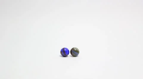 Marbles bumping back and forth Stock Footage 8852736