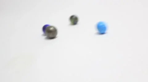Marbles bumping back and forth _2 Stock Footage 8852820
