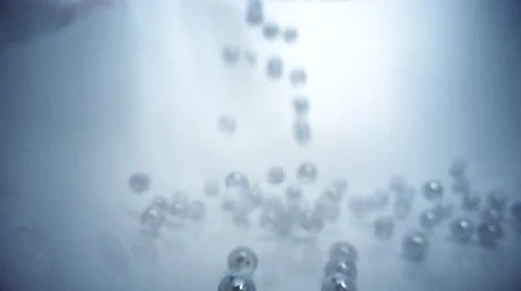 Marbles dropped in white background Stock Footage 60631293