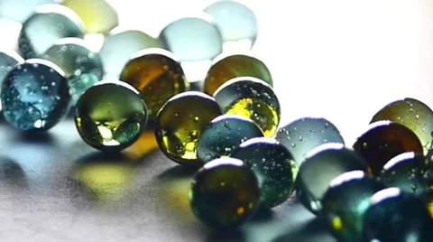 Marbles rolling, toy, taws. Small spherical balls. Stock Footage 62285333