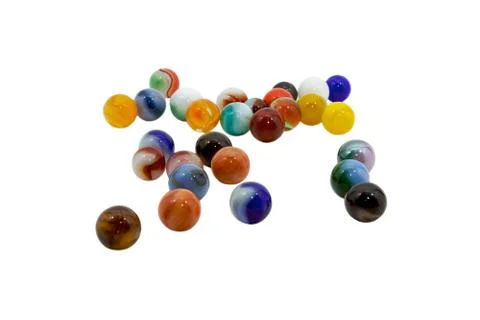 Marbles spread on white Stock Photos