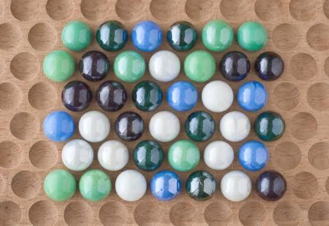 Marbles on wood Stock Photos