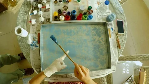 Marbling set ebru master sprinkles with brush blue paint on liquid in tray from  Stock Footage 82374804