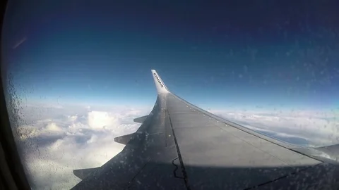 March 04, 2017 - Ryanair Boeing 737 is flying over the clouds in clear blue sky. 動画素材 74900634