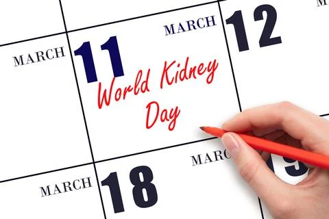 March 11. Hand writing text World Kidney Day on calendar date. Save the date. Stock Photos