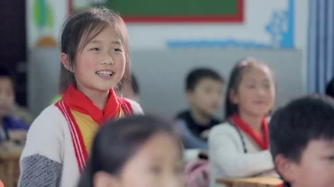March 13, 2026: Elementary school students and teacher smiling in a classroom. Stock Footage 330637780