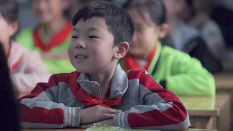 March 13, 2026: Elementary school students and teacher smiling in a classroom. Stock Footage 330637788