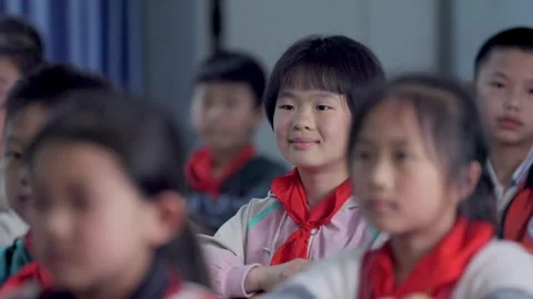 March 13, 2026: Elementary school students and teacher smiling in a classroom. Stock Footage 330637791