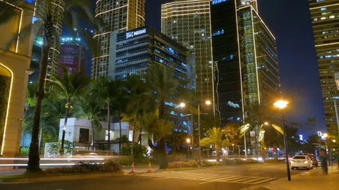March 17, 2017: Time lapse of night buildings, traffic and city life in Makati. Video stock 77054536