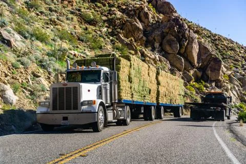 March 18, 2019 Borrego Springs / CA / USA - Truck transporting bailes of hay  Stock Photos