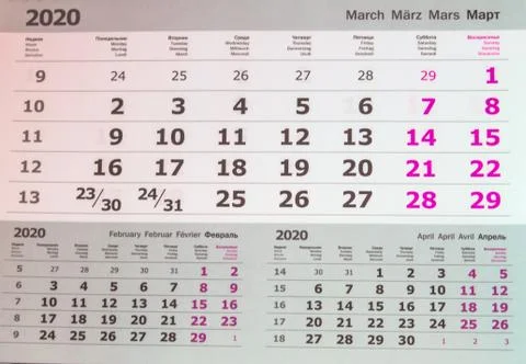 March 2020 calendar or desktop planner, top view, text in 4 languages English Stock Photos