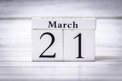 March 21 calendar date displayed on wooden blocks represents the first day of Stock Photos