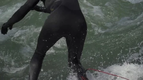 March 28, 2022. Munich, Germany. Eisbachwelle am Englischen Garten. Surfing am Stock Footage 294694559