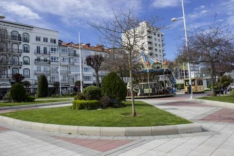 March 9, 2025, Castro, Spain, a waterfront square with designer trees Stock Photos