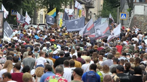March, marching, move, procession, parade of deceived nationalists. Stock Footage 134329106