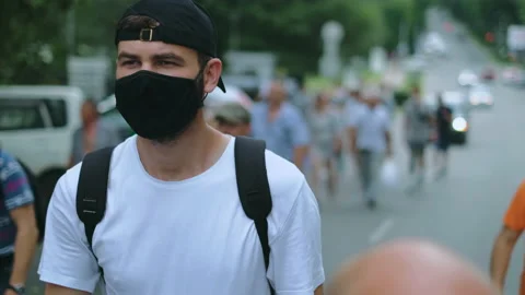 March resistance strike of masked protesting people under lockdown restriction. Stock Footage 165258528