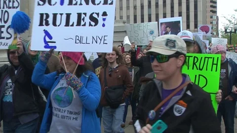 March for Science demonstrators carry signs, chant "Science not Silence" Stock Footage 74775991