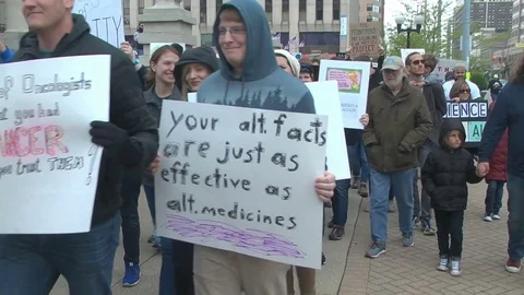 March for Science demonstrators carry signs, "Science not Silence" Stock Footage 74776055