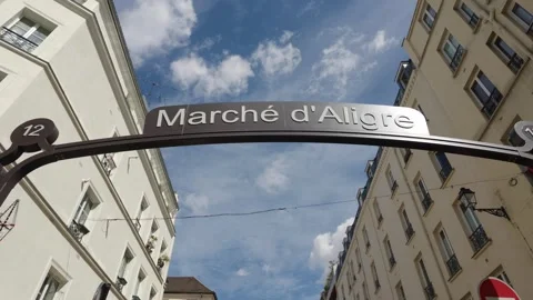 Marche d'Aligre market sign between Paris buildings Vídeos de archivo 344837903