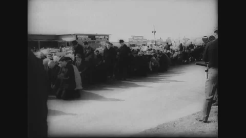 Marchers kneel down on street and pray - 1965 Stock Footage