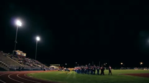 Marching Band Exiting Field at Night Stock Footage 22407982