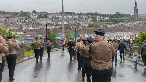 Marching band on a rainy day in Derry, Northern Ireland, 25 August 2024 Stock Footage 288113886