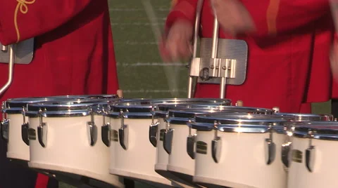 Marching bands drums corps and crowds on university college football field Stock Footage 53427204
