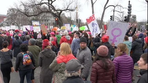 Marching, chanting toward Executive Office Building, Women's March on Washington Stock Footage