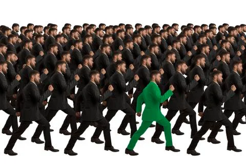 Marching clones with green individual, studio shot Stock Illustration