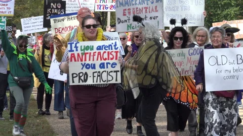 Marching to No Kings protest, singing anti-fascist tune, DC stock footage Stock Footage 319408917