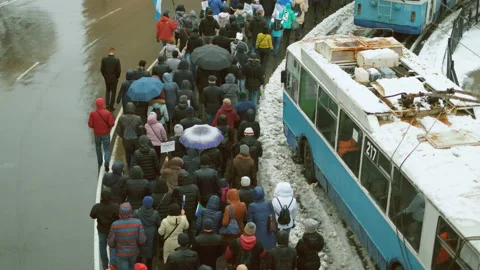 Marching picketing line of angry russian striking people. Civilian city unrest. Stock Footage 154345784