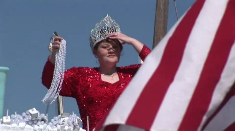 Mardi Gra Parade Float with Queen throwing beads Stock Footage 8652656