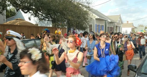 Mardi Gras Red Beans parade marches through Treme neighborhood New Orleans Stock Footage 90740871