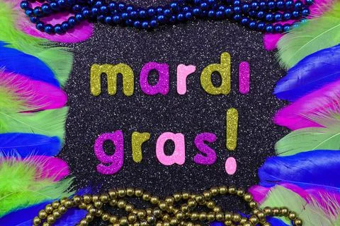 Mardi Gras Text With Bead Strings And Feathers Layout Stock Photos