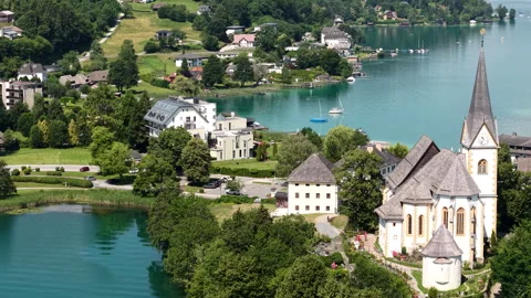 Maria Worth, Austria. Drone Shot of Catholic Church in Village on Worthersee 库存影片 339697647